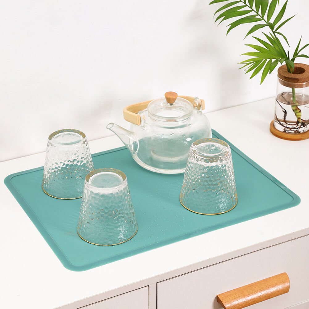 Teal Silicone Placemat with Rolled Napkins and Tableware for Dining Table