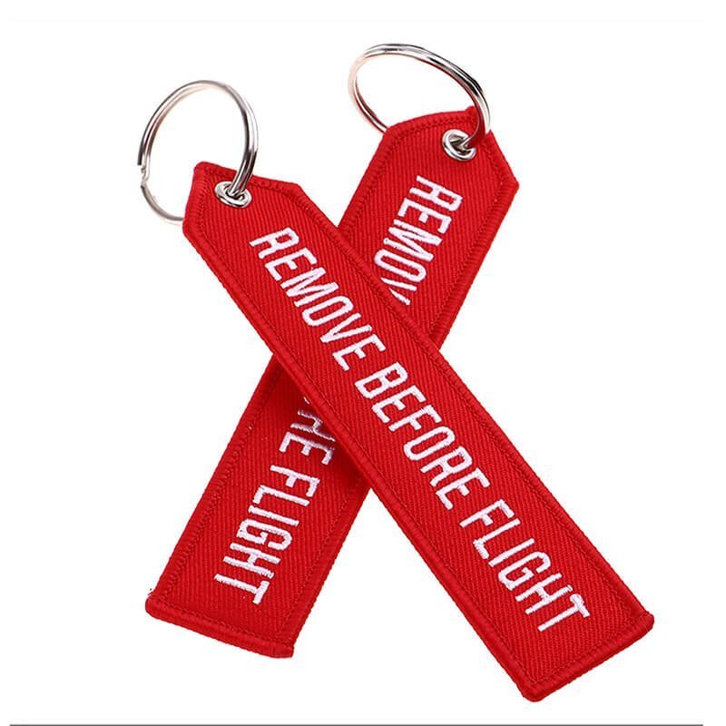 remove before flight keychain tag red fabric with white embroidery text double side print