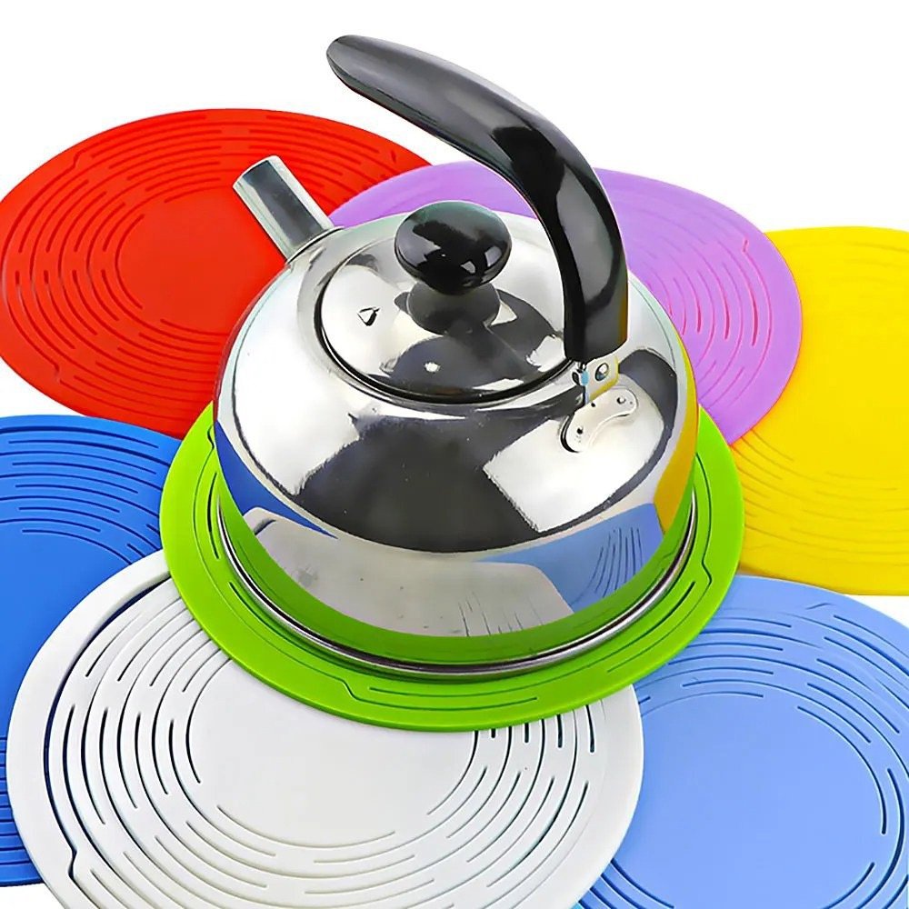 Colorful Silicone Trivets with a Kettle on the Green One