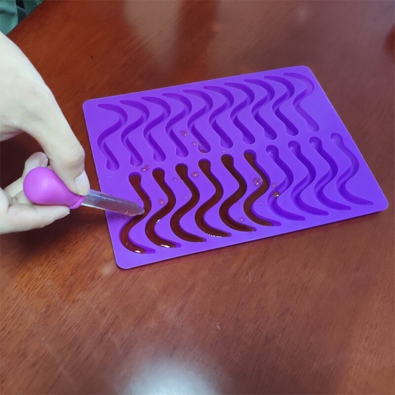 Filling Worm Gummy Mold with Dropper